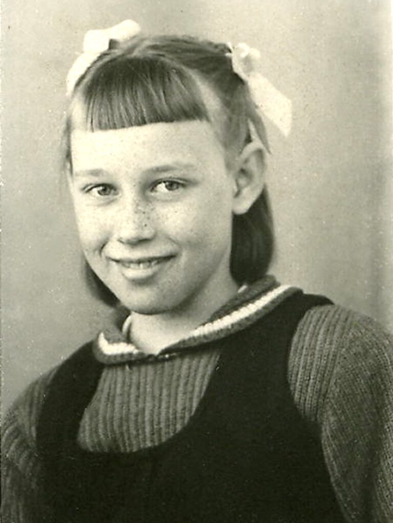 a young freckled-faced schoolgirl in the early 1940s