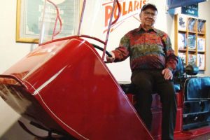 David Johnson of Roseau, Minn., sits on Polaris snowmobiles No. 2, built in 1956, in February 2015 inside the Polaris Experience Center in Roseau, Minn. Johnson, 93, died XX in Roseau. (Brad Dokken photo)